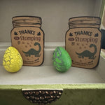Colorful crackle dinosaur hatchable eggs arranged with a “Thanks for Stomping By” tag—ideal for kids’ dinosaur-themed party favors and goodie bags.